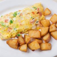 Western Omelet · Ham, onions, peppers, tomatoes & cheese.