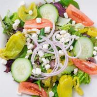 Greek Salad · Mixed greens, tomatoes, cucumber, Kalamata olives, pepperoncini peppers & feta cheese.