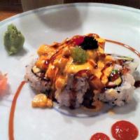 Hot Lava Roll · California roll topped with baked scallops, spicy aioli, eel sauce and tobiko (roe)