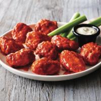 Boneless Wings · 6 or 12 tossed in mild buffalo or BBQ served with a ranch or blue cheese