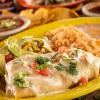 Lupita'S Chimi · Meat, beans, cheese, and pico de gallo. Topped with white queso, served with Spanish rice & ...