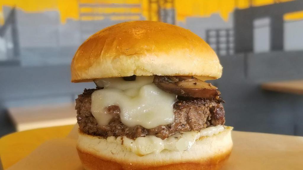 Mushroom Swiss · 1/4lb of certified angus steak burger, grilled mushrooms, Swiss cheese and mayonnaise served on our brioche bun