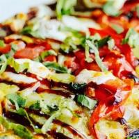 Greek The Freak · Garlic olive oil base with feta cheese, red onion, fresh spinach, roasted red peppers, orega...