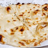 Naan (V) (Organic) · Traditional white flour indian favorite topped with butter.