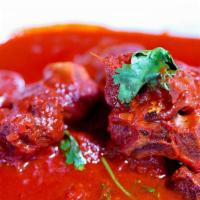 Vindallo(Goan Red Curry) Gf · Spicy goan curry, tomato sauce and aged vinegar.