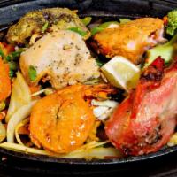 Tandoori Mixed Grill · Assortment of chicken, fish, lamb and shrimp. Tandoor is a clay oven, marinated freshly bake...