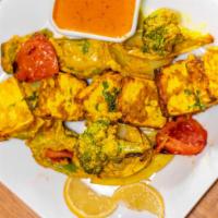 Paneer Tikka · Cheese cubes, peppers, onion and tomatoes. Tandoor is a clay oven, marinated freshly baked t...