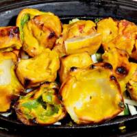Tofu Tikka · Skewered tofu, peppers, onion and tomatoes. Tandoor is a clay oven, marinated freshly baked ...