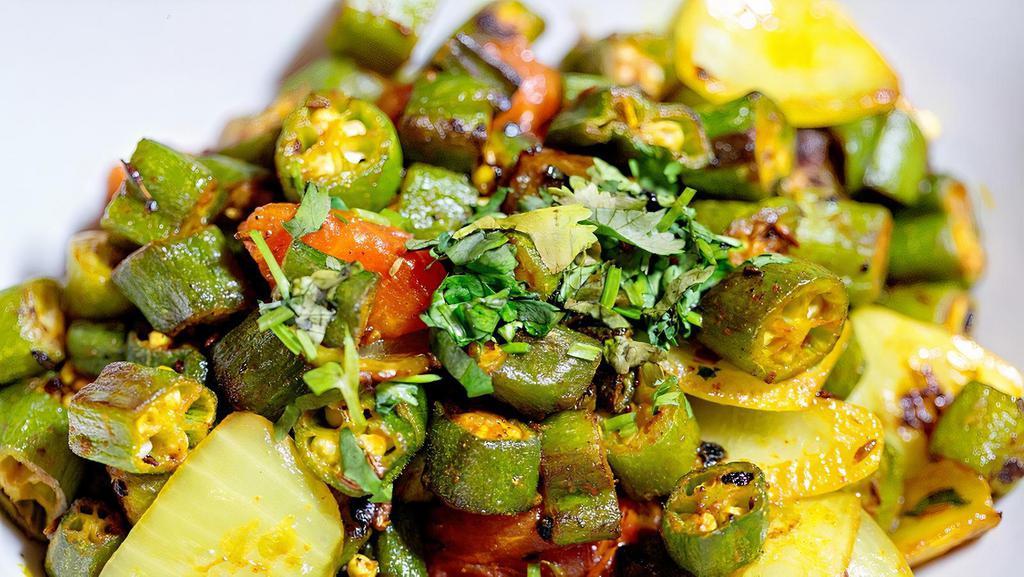 Bhindi Masala (Gf/V) · Cut okra, peppers, onions, tomatoes, ginger, garlic, fenugreek, herb and masalas.