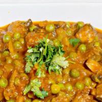Khumb Matar Masala · Mushroom, peas, onions, tomatoes and coriander seeds. Vegan. Gluten free.