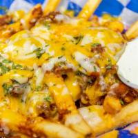 Chili Cheese Fries · Hand cut and seasoned fries topped with homemade chili and melted shredded cheese.  Served w...