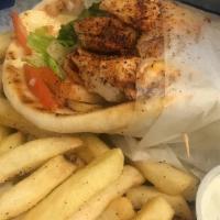 Chicken · Grilled chicken with shredded cheddar, lettuce, tomato, and onion rolled in a warm pita. Mak...