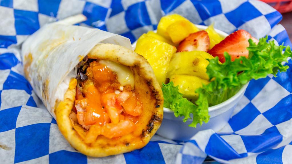 Buffalo Chicken · Buffalo chicken with pepper jack cheese, lettuce, tomato, and onion rolled in a warm pita.