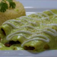 Yolandas · Three chicken enchiladas topped with mole salsa. Served with rice and salad.