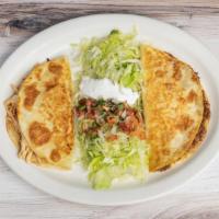 Supreme Quesadillas · Two quesadillas, one with shredded chicken and one with ground beef. Served with lettuce, pi...