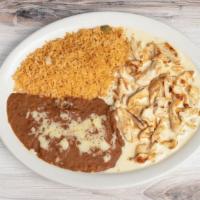 Pollo Con Crema · Grilled chicken, onions, cooked in sour cream-cheese dip sauce. Served with rice, beans and ...