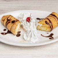 Mexican Cheescake · Cheesecake wrapped in a flour tortilla and deep-fried with sugar, cinnamon, whipped cream an...