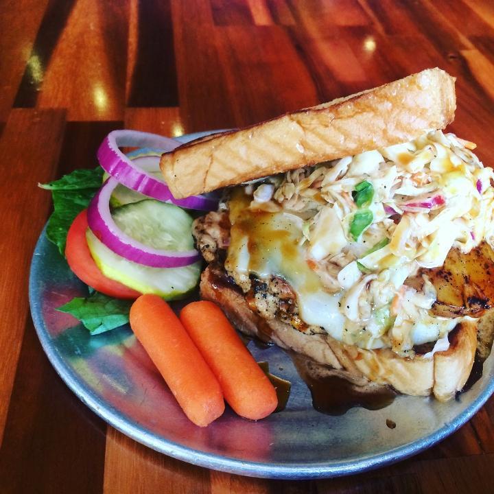 Flying Hawaiian Burger · A hand pattied 1/3 lb. ground chicken burger topped with provolone, pineapple, kickin slaw, tomatoes and teriyaki sauce on texas toast.