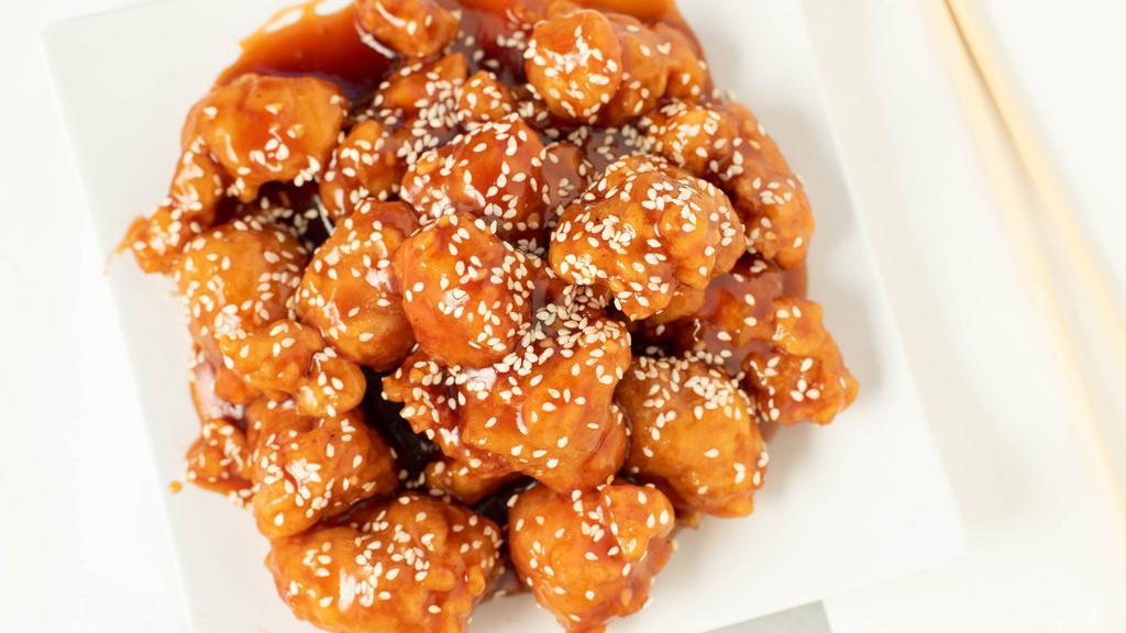 Sesame Chicken · With sesame seeds with broccoli.