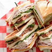 Shady Lane Club · Our classic club piled high with ham, turkey bacon, lettuce, tomato, and cheddar cheese.