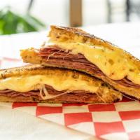 New York Reuben · Another grilled classic with corned beef and sauerkraut on rye, topped with swiss cheese and...