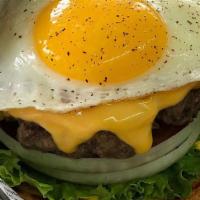 The Hangover Burger · Fried egg, crispy bacon, American cheese, lettuce, tomato, onion, pickle, mayo, mustard.