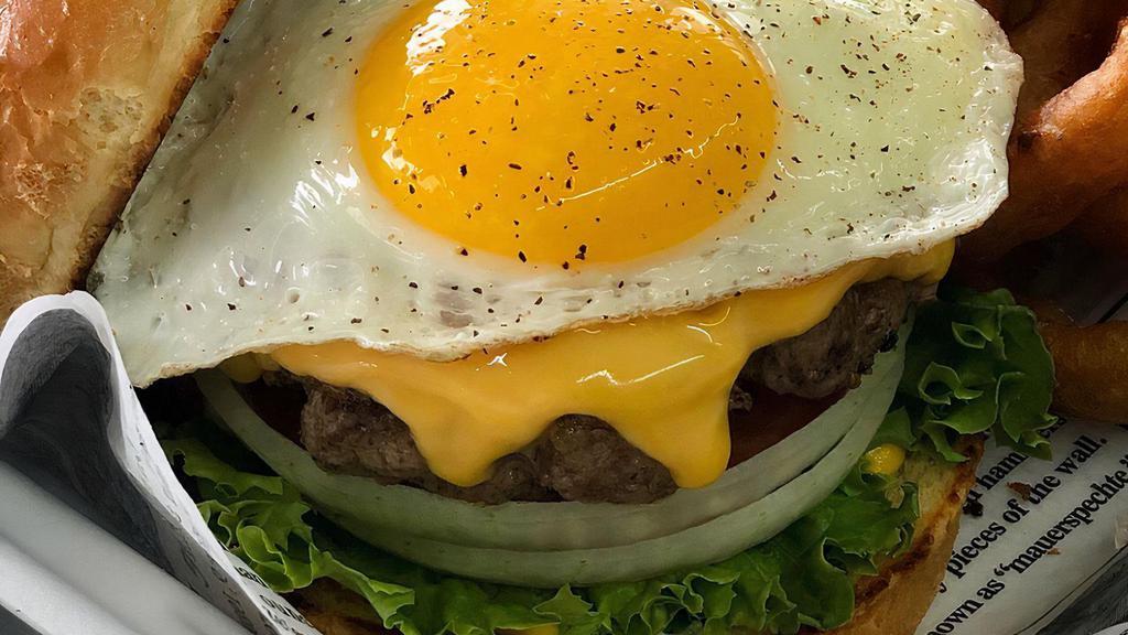 The Hangover Burger · Fried egg, crispy bacon, American cheese, lettuce, tomato, onion, pickle, mayo, mustard.