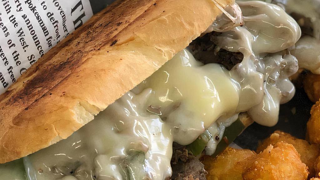 The Philly Steak · Philly steak, provolone cheese, grilled onion, grilled bell pepper, mayo, on toasted hoagie bun.