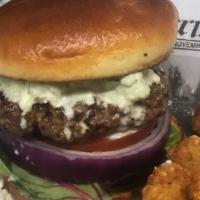 The Greek Burger · Crumbled feta cheese, red onion, spring mix, tomato, drizzled with tzatziki sauce & Mediterr...