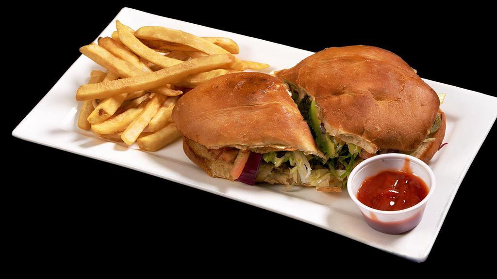 Tortas · Bolillo bread , prepared with beans , sliced tomato , onions , mayo , jaleño peppers ,avocado and cheese served with fries .