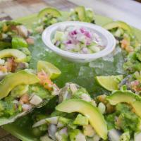 Ostiones Culichi * · A mix of chopped cucumber , tomato , onion , cilantro , avocado , fish and raw oysters marin...