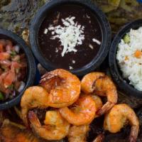 Molcajete Riviera * · Grilled beef ribs , chicken breast , 9 jumbo shrimps , cactus , onions , grilled jalapeno pe...