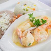 Camarones Gratinados · Large mexican prawns cooked in our seafood creamy sauce served with rice , beans and pico de...