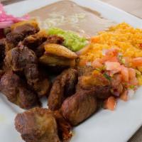 Pork Carnitas · Traditional mexican carnitas served with rice and beans , guacamole , sour cream and pico de...