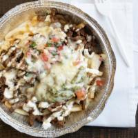 Carne Asada Fries · Our delicious California style fries, topped with diced steak, cheese, pico de gallo, guacam...