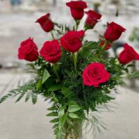 Arranged Roses  · Long Stem Roses Arranged in Vase

Traditional - Roses arranged, greenery in a classic vase

...