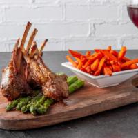 Baby Lamb Chops · Three marinated french-cut baby lamb chops grilled to order and served with charred asparagu...