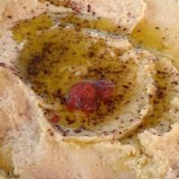 Hummus Dip · Chickpeas, garlic, lemon juice, and sesame paste. Served with pita bread.