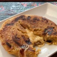 Plantain Arepa · A fullmoon patty dough made from ripe plantains and stuffed with cheese, jalapeño and chipot...