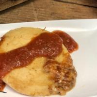Pork Pupusa · A thick griddle cake from El Salvador made with cornmeal and stuffed with cheese and pork