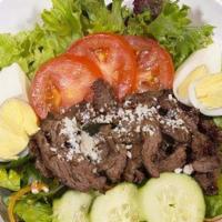 Steak Salad · House salad toped with sliced steak, sliced tomatoes, cucumbers, queso fresco and hard-boile...
