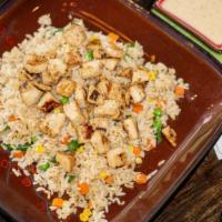 Hibachi Chicken Fried Rice · Tender white meat chicken grilled with teriyaki sauce, and fried rice with diced carrots, pe...