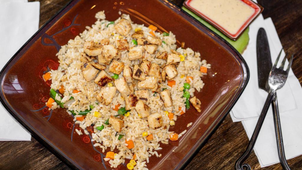 Hibachi Chicken Fried Rice · Tender white meat chicken grilled with teriyaki sauce, and fried rice with diced carrots, peas, onions, coma and string beans.