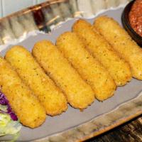 Cheese Sticks (6) · Six pieces. Breaded and golden fried mozzarella cheese, served with marinara sauce.