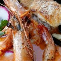 Seafood Moqueca · Seared Sea Scallops, Prawns, Mussels, Savory Tomato Broth, Jasmine Rice, Coconut, Ginger Oil...