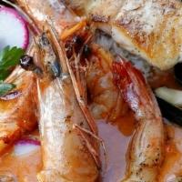 (Gf) Seafood Moqueca · Seared Sea Scallops, Mussels, Shrimp, Savory Tomato Broth, Jasmine Rice, Coconut, Ginger Oil...