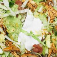 Nachos Supreme Mix · Beef and chicken, refried beans, cheese, lettuce, sour cream, pico de gallo and guacamole on...
