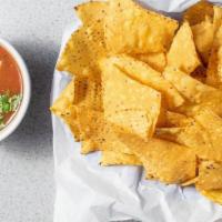 Chips Con Salsa · chips with fresh tomato Salsa. Served with tortilla chips.