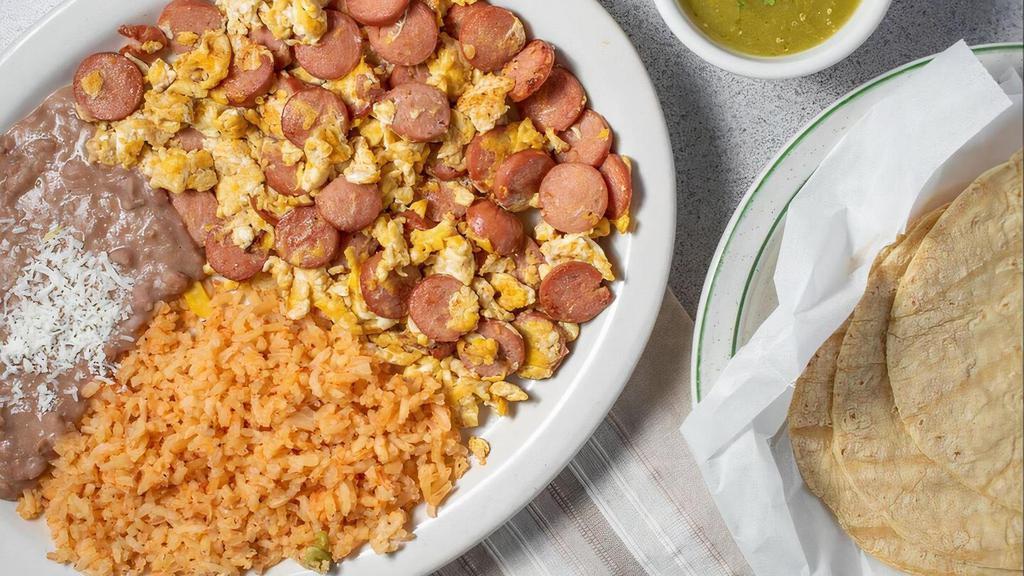 Huevos Con Salchicha Combo · scrambled eggs & sausage served with rice, refried beans, tortillas, and homemade hot sauce.