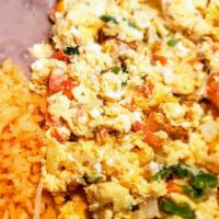 Huevos A La Mexicana Combo · scrambled eggs mixed with diced onion, dice tomato, and chopped serrano peppers. served with...